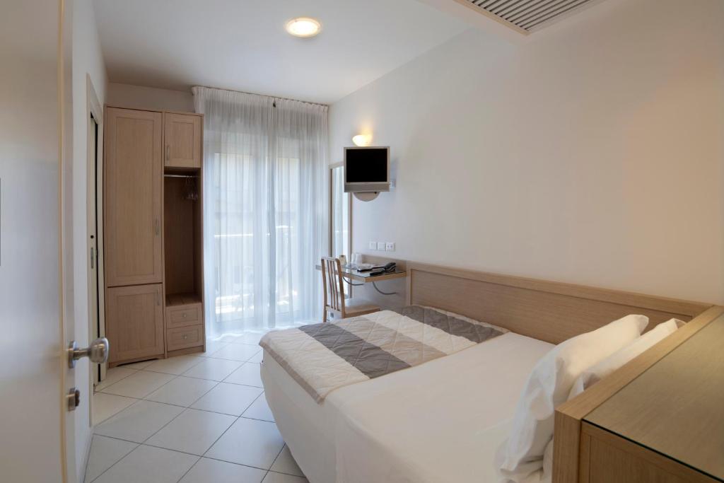 Postel nebo postele na pokoji v ubytování Hotel Gala