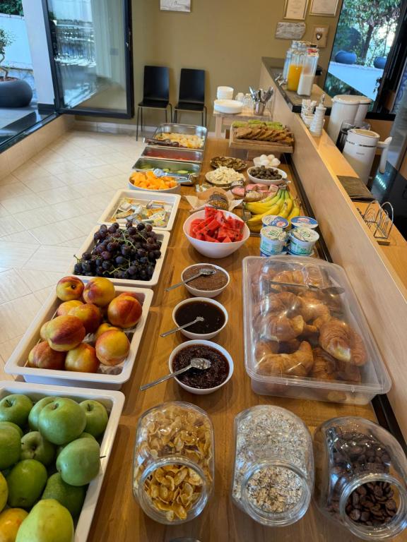 a buffet line with many different types of fruits and vegetables at Villa White in Ksamil