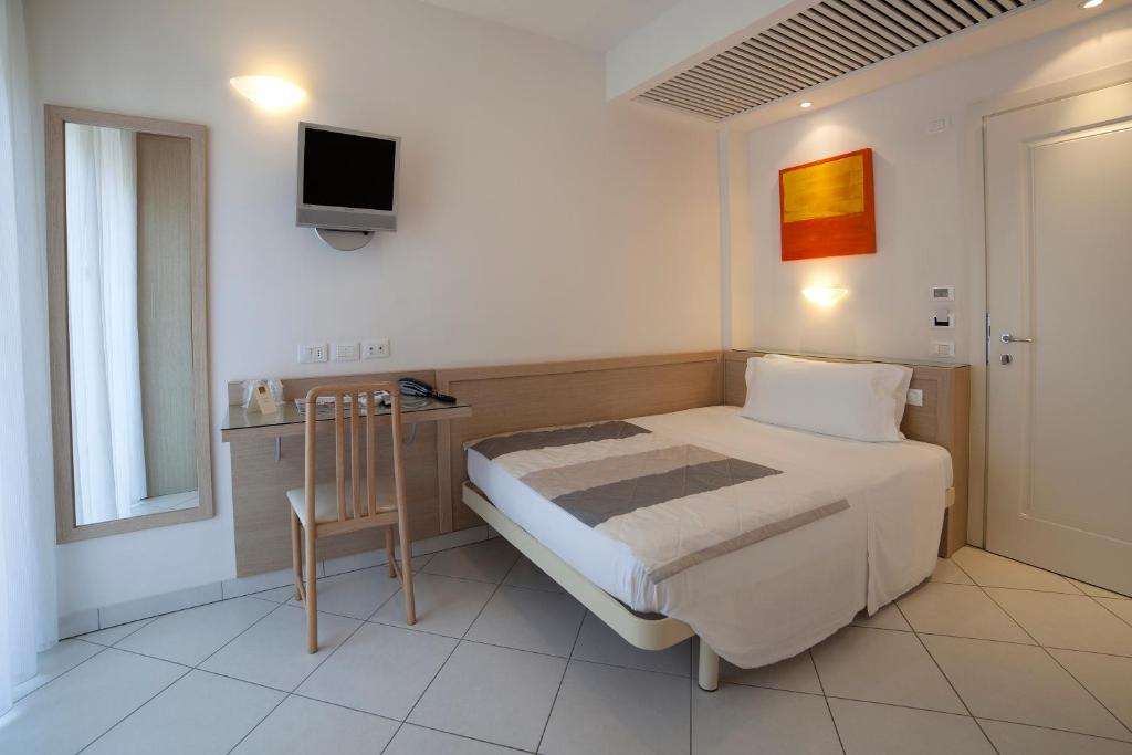 Postel nebo postele na pokoji v ubytování Hotel Gala