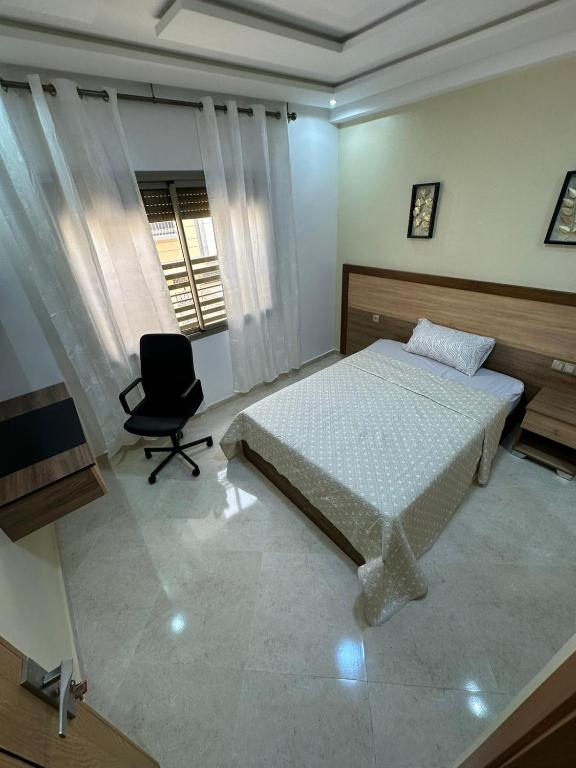 Postel nebo postele na pokoji v ubytování appartement à fes
