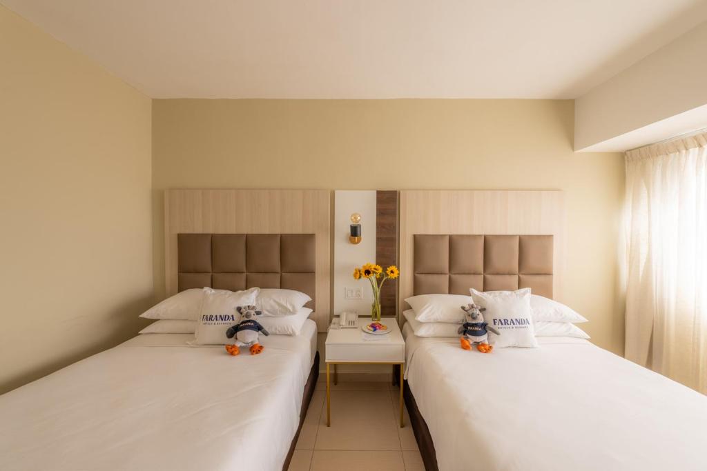 Postel nebo postele na pokoji v ubytování Hotel Faranda Express Soloy and Casino, a member of Radisson Individuals