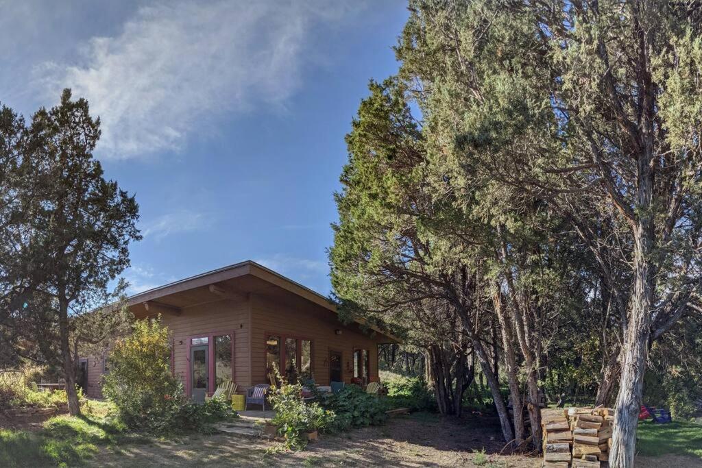 a small wooden house with trees in front of it at Paradise Valley Oasis - Your Yellowstone Base Camp in Flying Y Ranch Airport