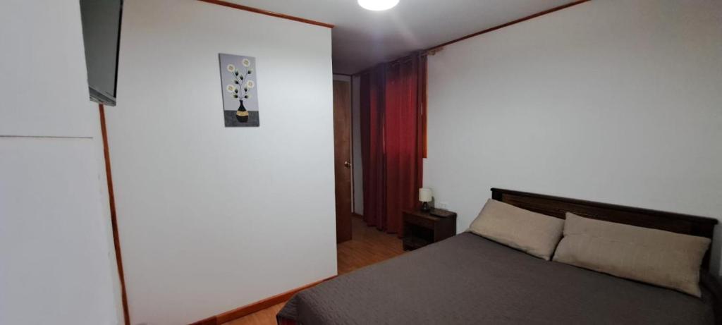 Postel nebo postele na pokoji v ubytování Hotel Cordillera Cabildo