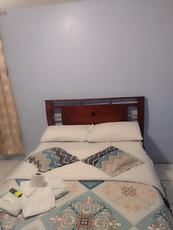 Postel nebo postele na pokoji v ubytování Hostal mariajose baños