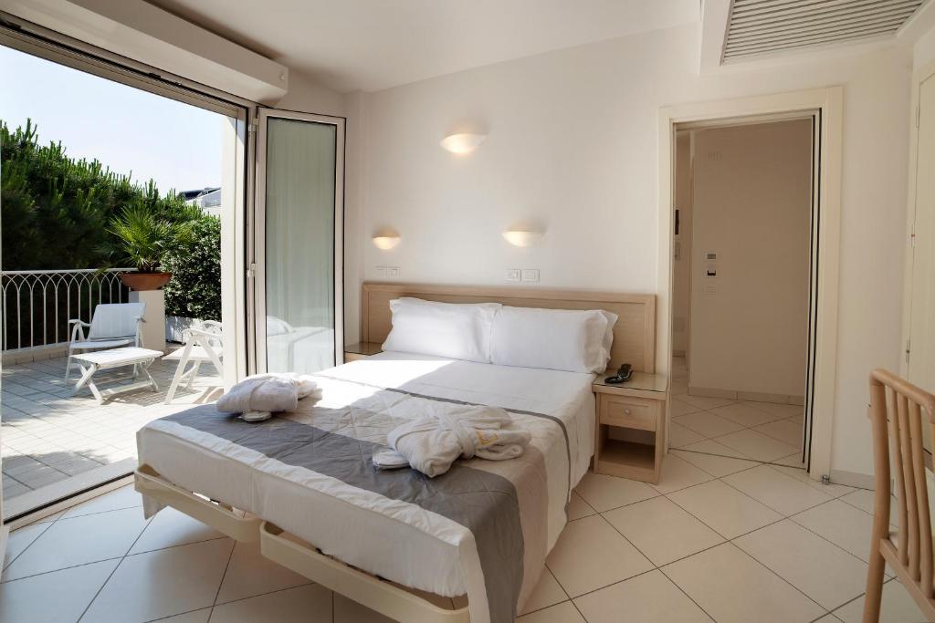 Postel nebo postele na pokoji v ubytování Hotel Gala