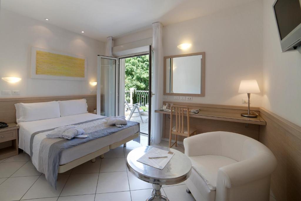 Postel nebo postele na pokoji v ubytování Hotel Gala