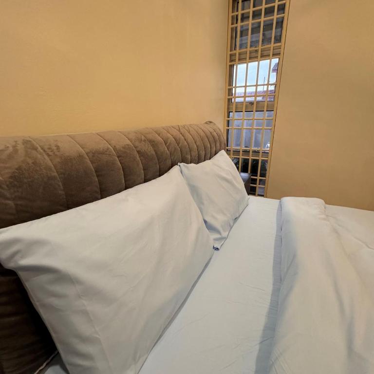 7pax single story corner ALMA Near AEON 大山脚客房内的一张或多张床位