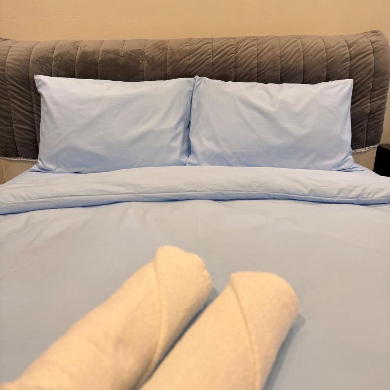 7pax single story corner ALMA Near AEON 大山脚客房内的一张或多张床位