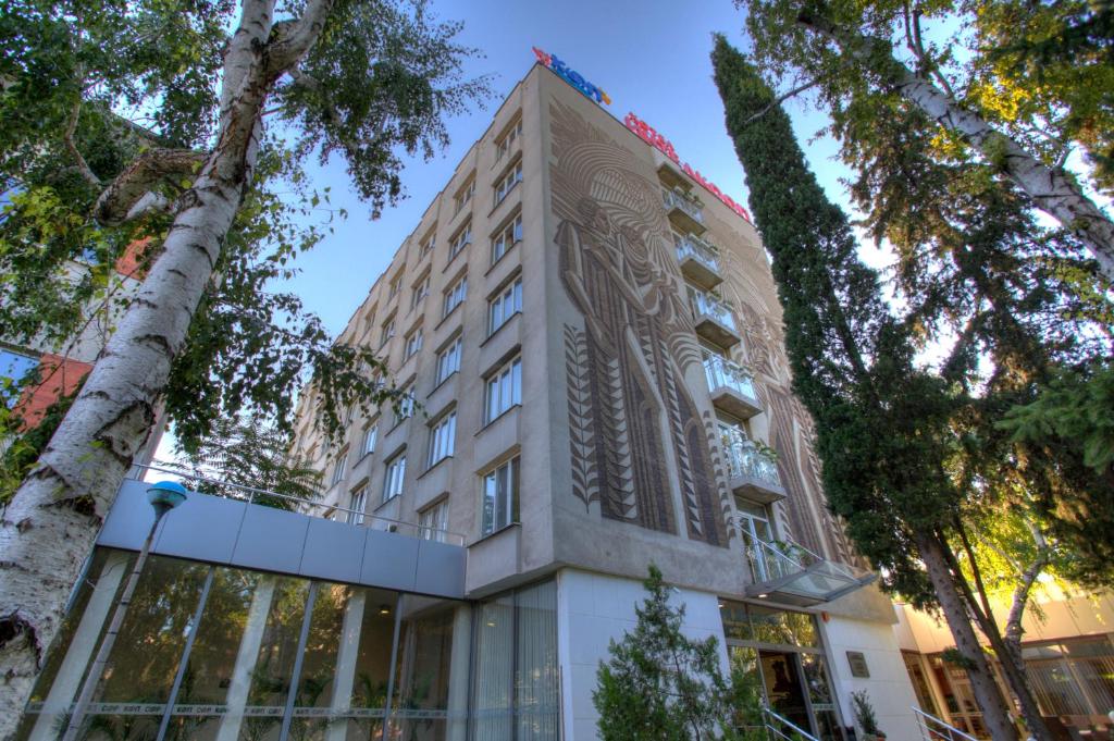 a building with a mural on the side of it at Hotel Intelcoop in Plovdiv