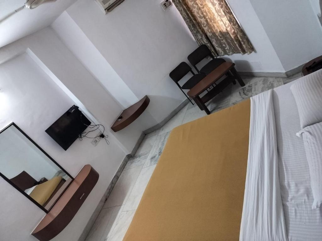 Postel nebo postele na pokoji v ubytování AKSHAY RESIDENCY