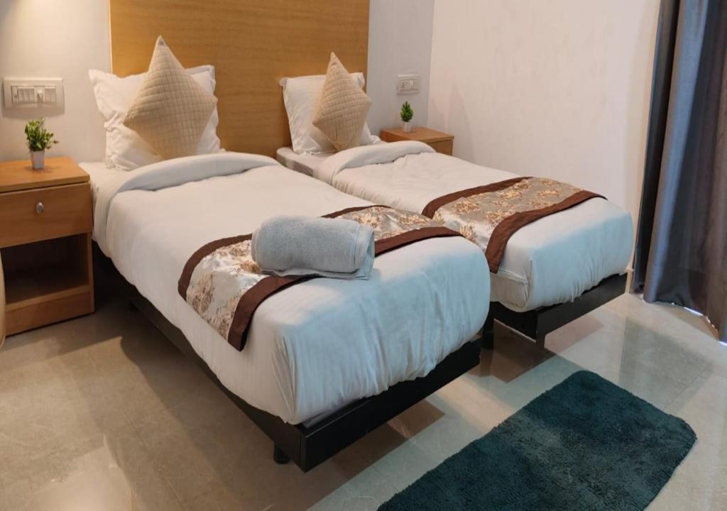 Postel nebo postele na pokoji v ubytování Akshay home stay