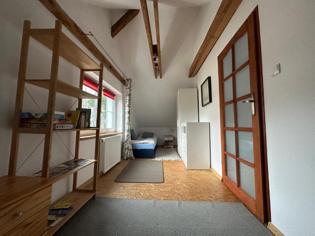 Posteľ alebo postele v izbe v ubytovaní Apartament na poddaszu
