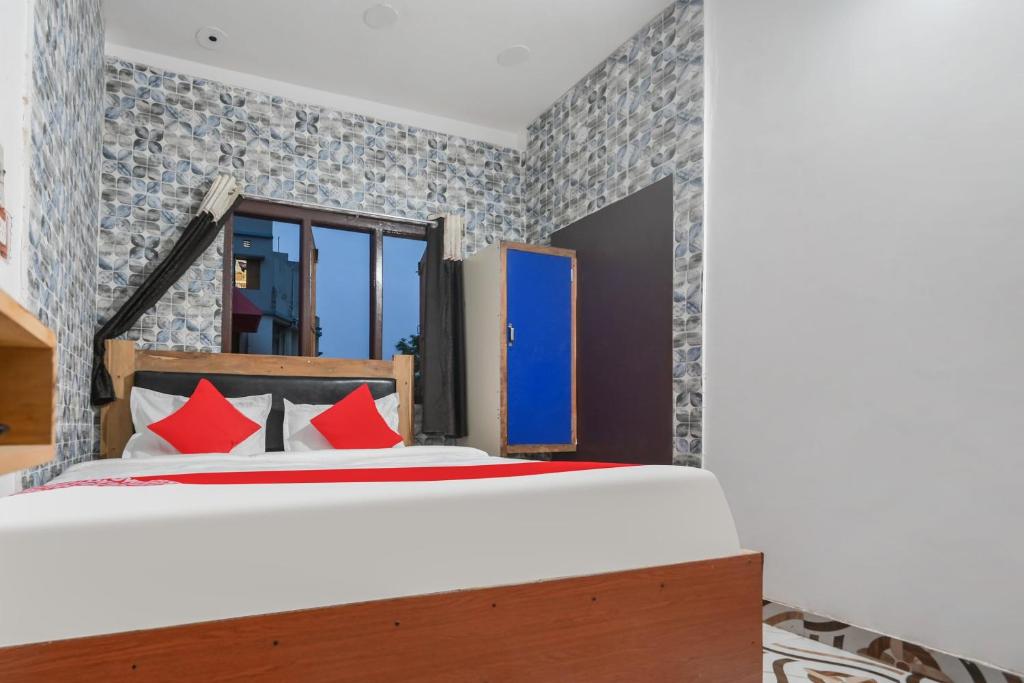 Postel nebo postele na pokoji v ubytování Hotel O ARES RESIDENCY