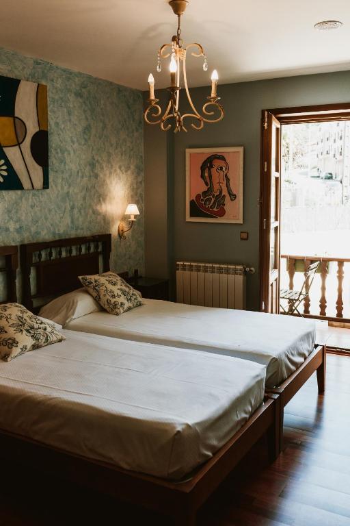 Postel nebo postele na pokoji v ubytování Casa da Capilla
