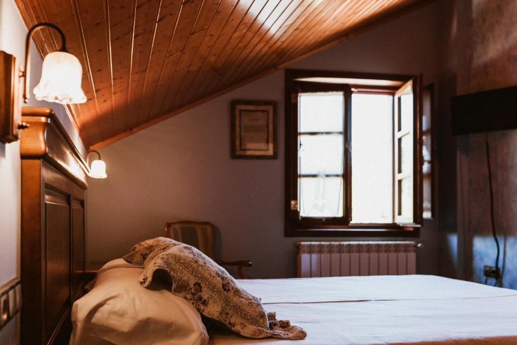 Postel nebo postele na pokoji v ubytování Casa da Capilla