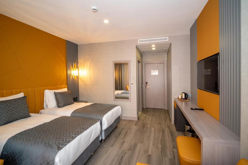 Postel nebo postele na pokoji v ubytování Icon Hotel Bomonti