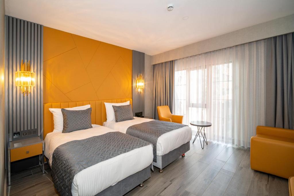 Postel nebo postele na pokoji v ubytování Icon Hotel Bomonti