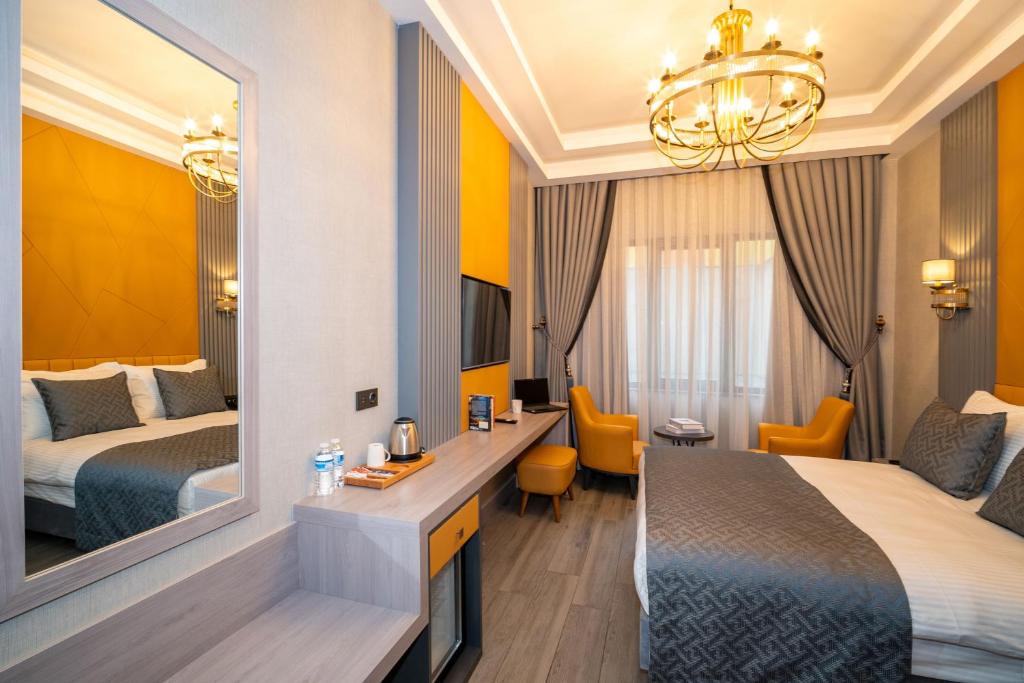 Postel nebo postele na pokoji v ubytování Icon Hotel Bomonti