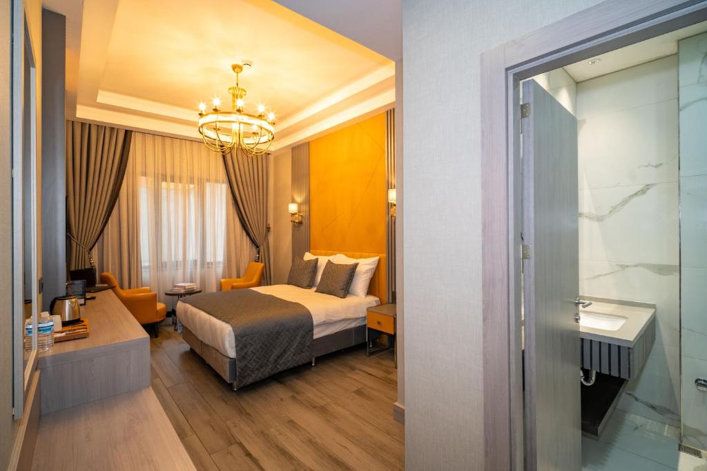 Postel nebo postele na pokoji v ubytování Icon Hotel Bomonti