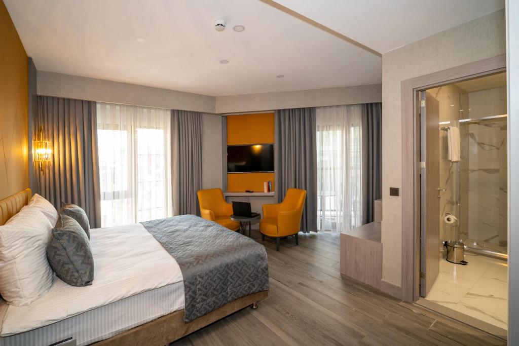 Postel nebo postele na pokoji v ubytování Icon Hotel Bomonti