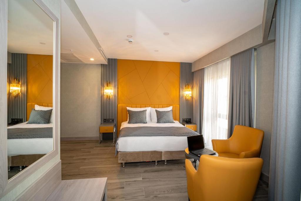 Postel nebo postele na pokoji v ubytování Icon Hotel Bomonti