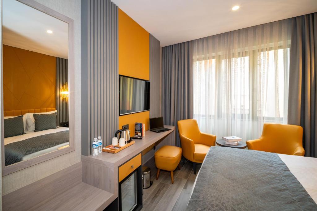 Postel nebo postele na pokoji v ubytování Icon Hotel Bomonti