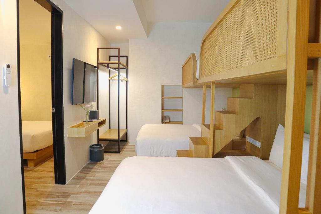 Postel nebo postele na pokoji v ubytování Mandarin Nest Boracay