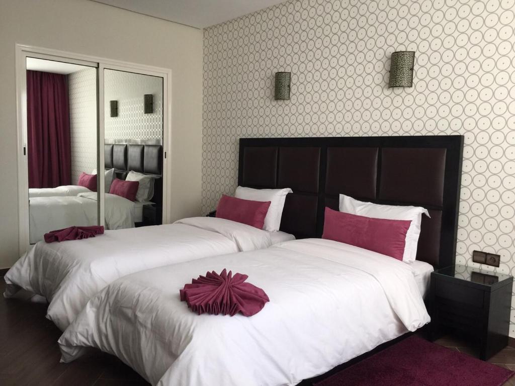 Postel nebo postele na pokoji v ubytování Hotel Swani
