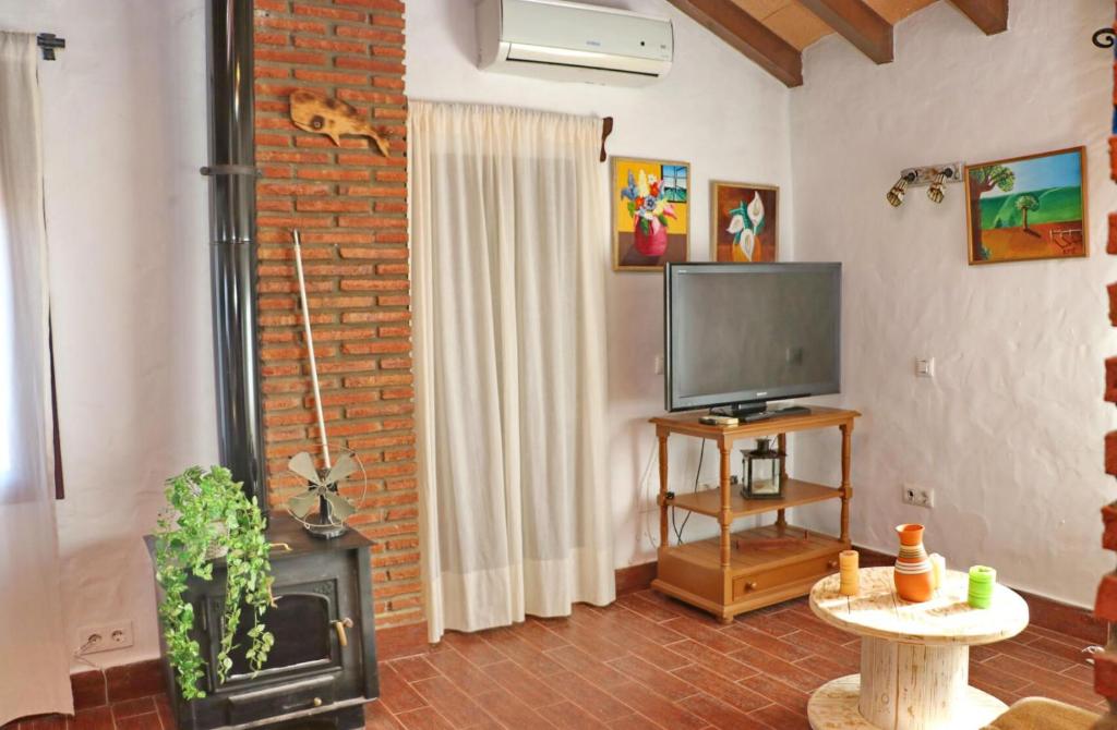 Televízia a/alebo spoločenská miestnosť v ubytovaní Apartamento Chinarejo