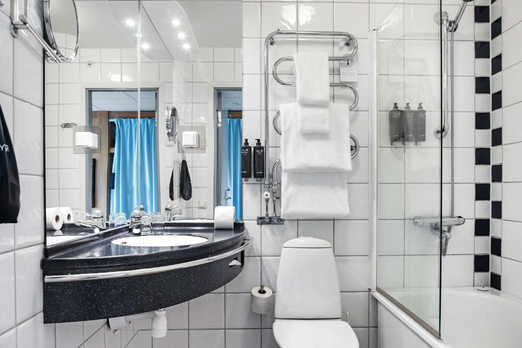 a bathroom with a sink and a toilet and a shower at Best Western Plus Park City Solna in Solna