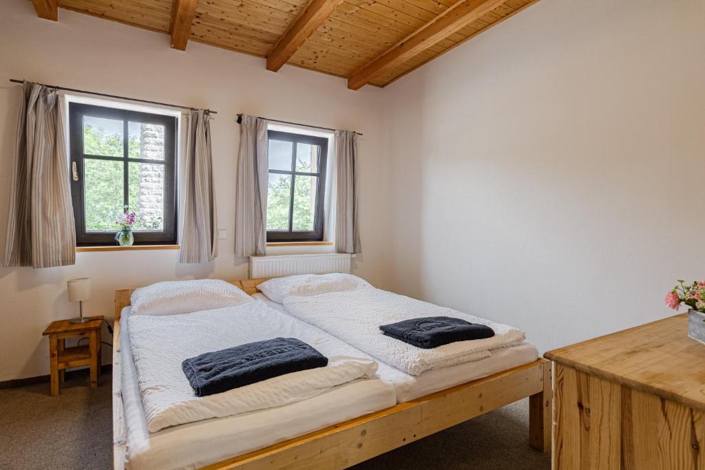 Postel nebo postele na pokoji v ubytování Chata Bramberk