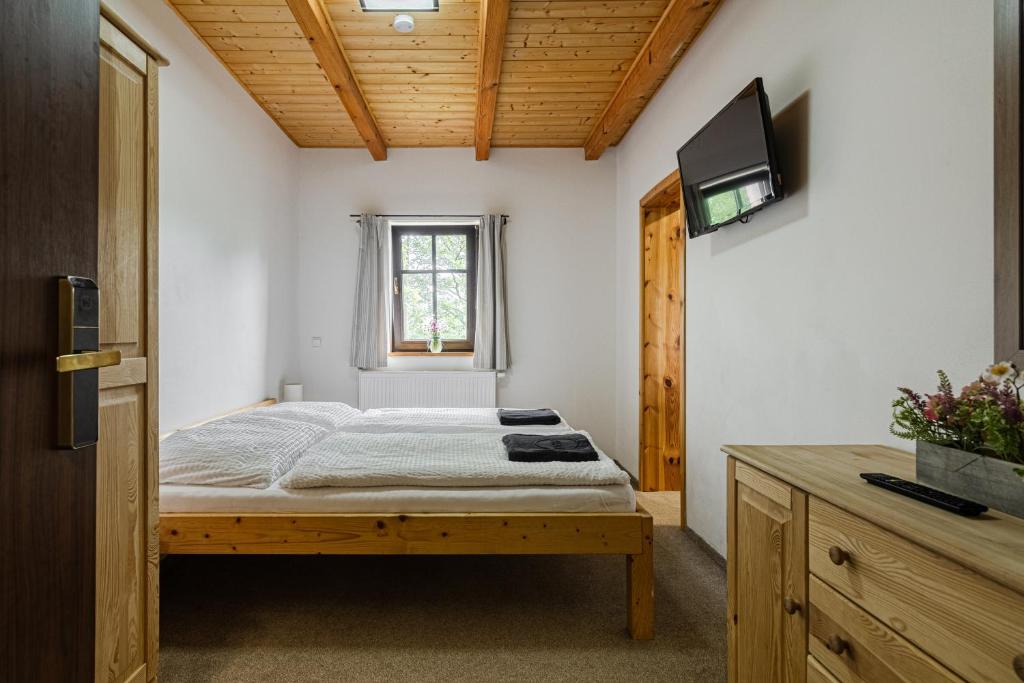 Postel nebo postele na pokoji v ubytování Chata Bramberk