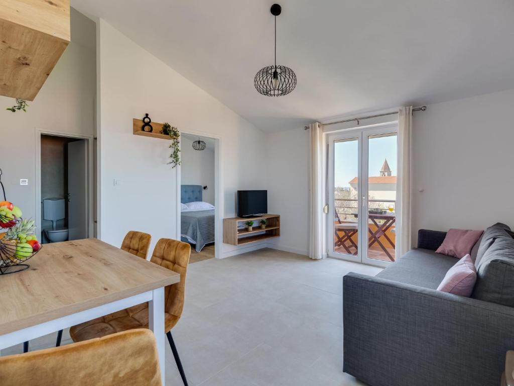 Telewizja i/lub zestaw kina domowego w obiekcie Apartment Bonex-7 by Interhome