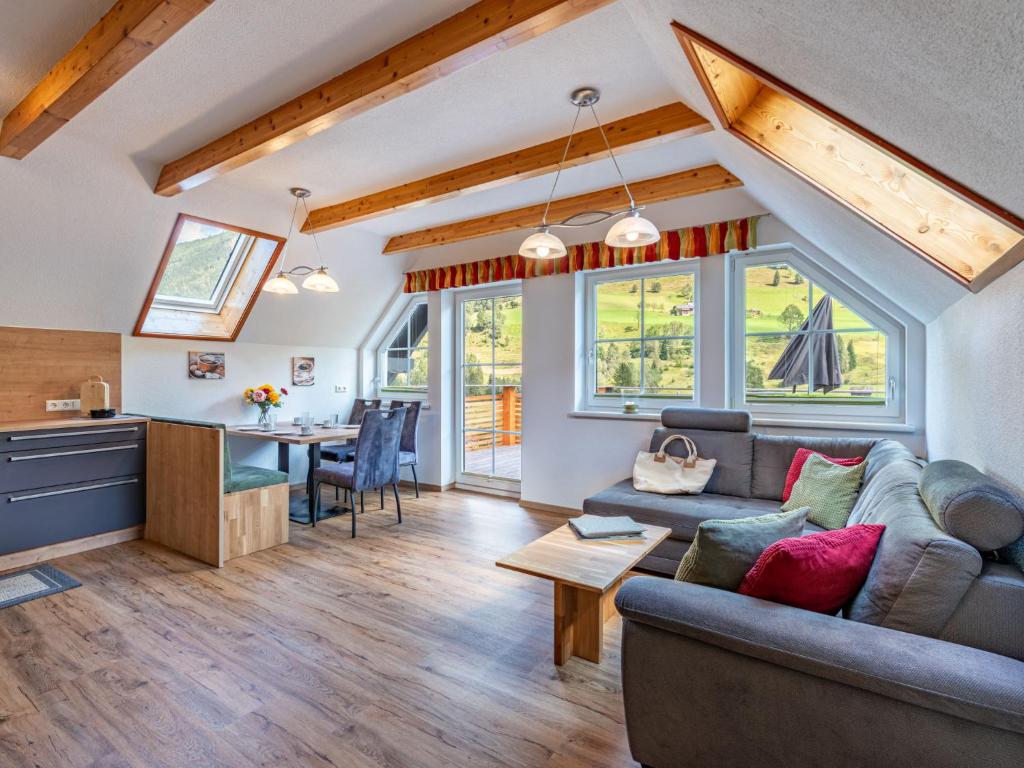 a living room with a couch and a table at Apartment Karlspitz by Interhome in Kleinsölk