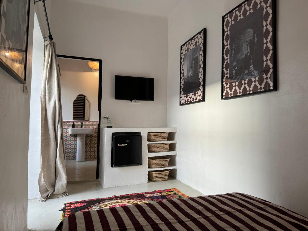 Postel nebo postele na pokoji v ubytování Riad Ait El Mouden