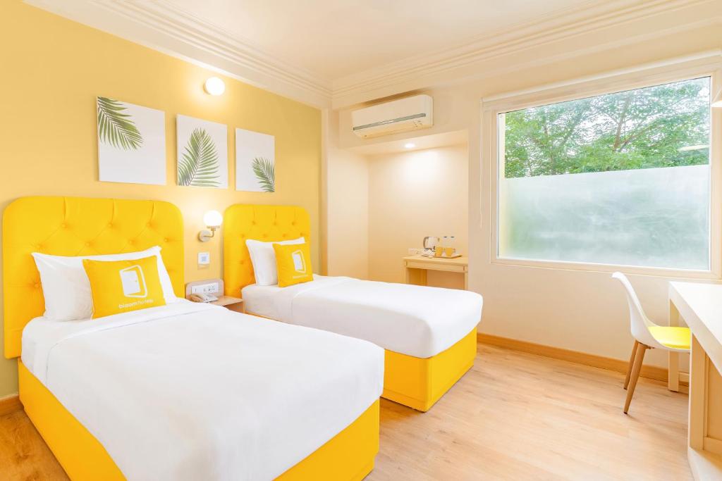 Postel nebo postele na pokoji v ubytování Bloom Hotel - CR Park
