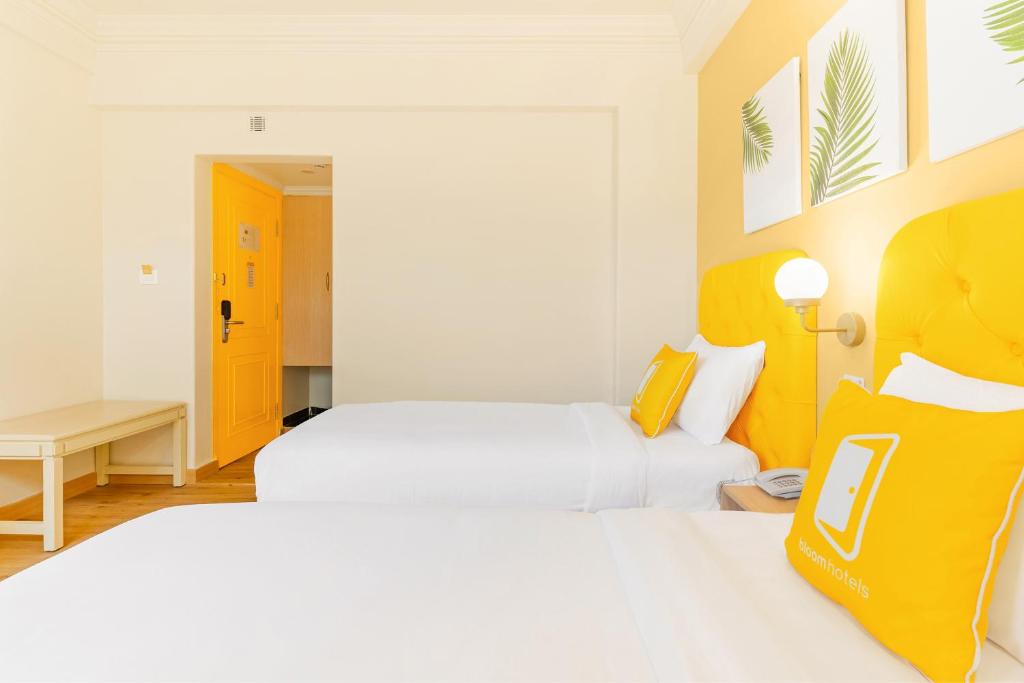 Postel nebo postele na pokoji v ubytování Bloom Hotel - CR Park