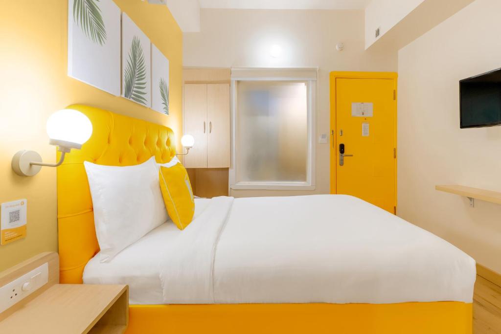 Postel nebo postele na pokoji v ubytování Bloom Hotel - CR Park