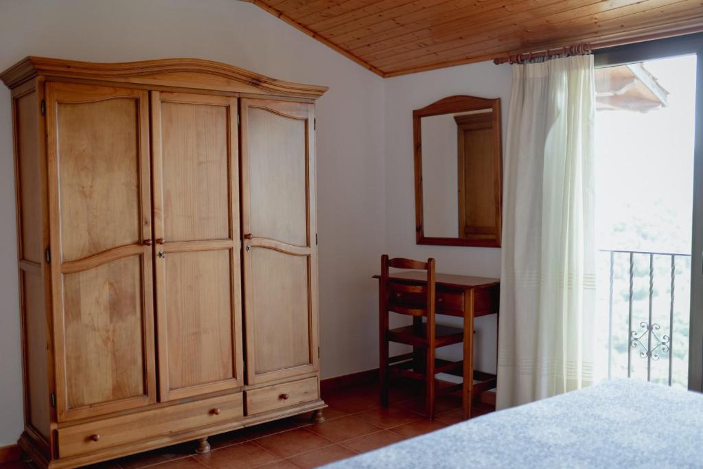 Postel nebo postele na pokoji v ubytování El Portal de la Irene Apartamentos Rurales