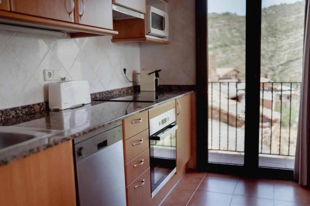 Kuchyň nebo kuchyňský kout v ubytování El Portal de la Irene Apartamentos Rurales
