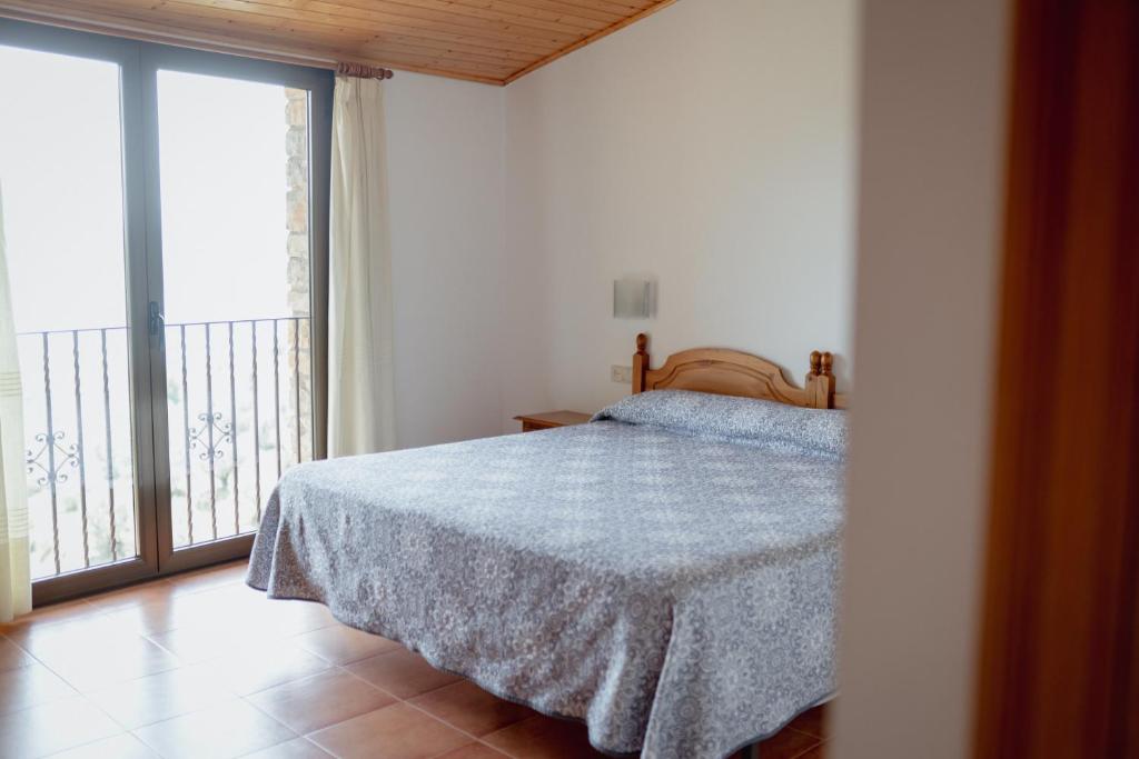 Postel nebo postele na pokoji v ubytování El Portal de la Irene Apartamentos Rurales