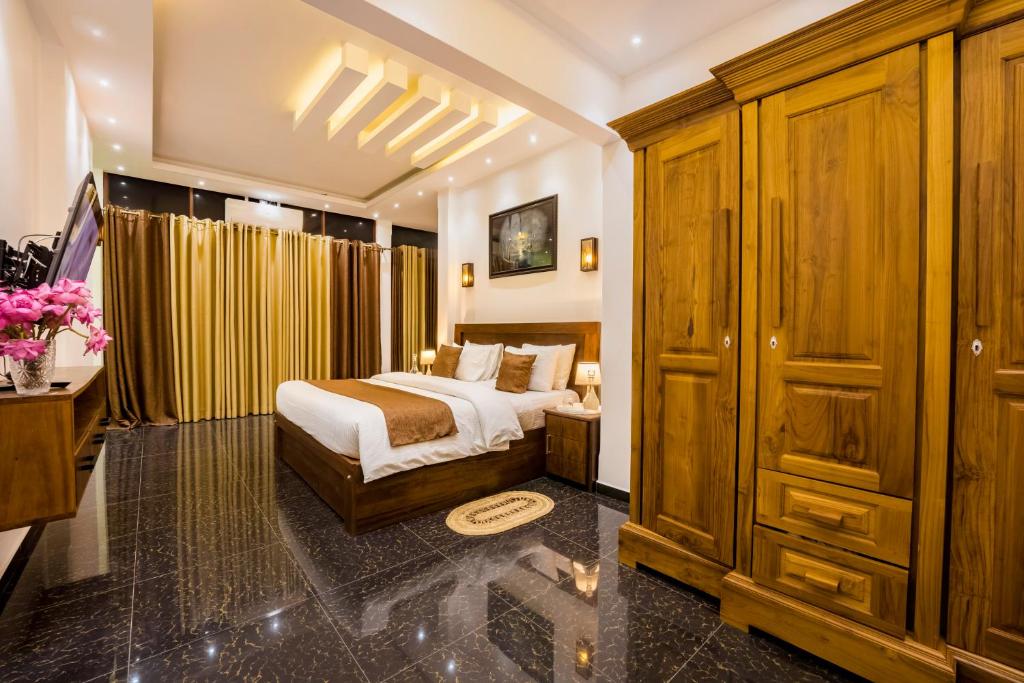 Postel nebo postele na pokoji v ubytování ThiThi's Palace