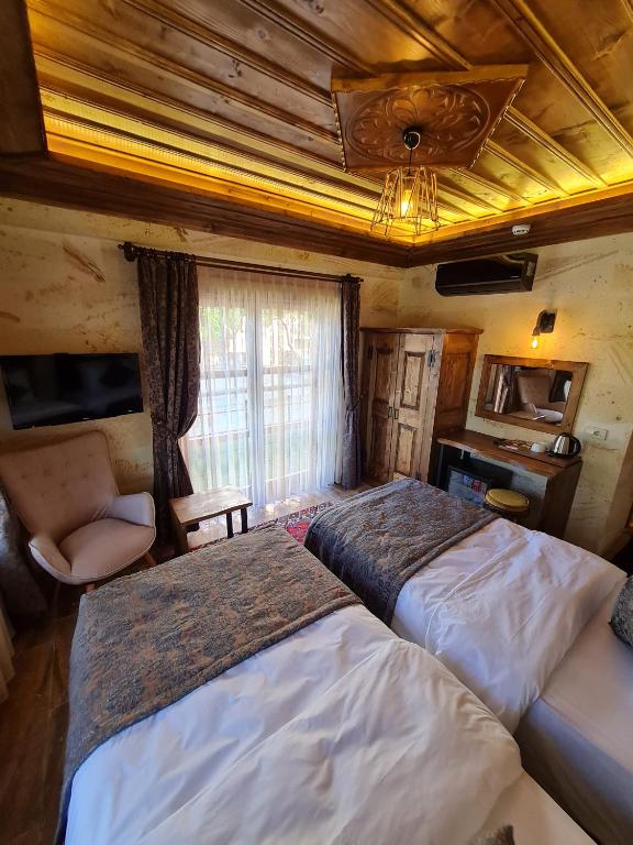 Postel nebo postele na pokoji v ubytování Flavia Cappadocia Hotel