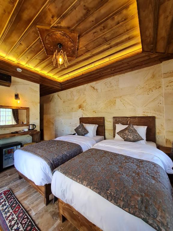 Postel nebo postele na pokoji v ubytování Flavia Cappadocia Hotel