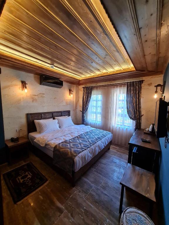 Postel nebo postele na pokoji v ubytování Flavia Cappadocia Hotel
