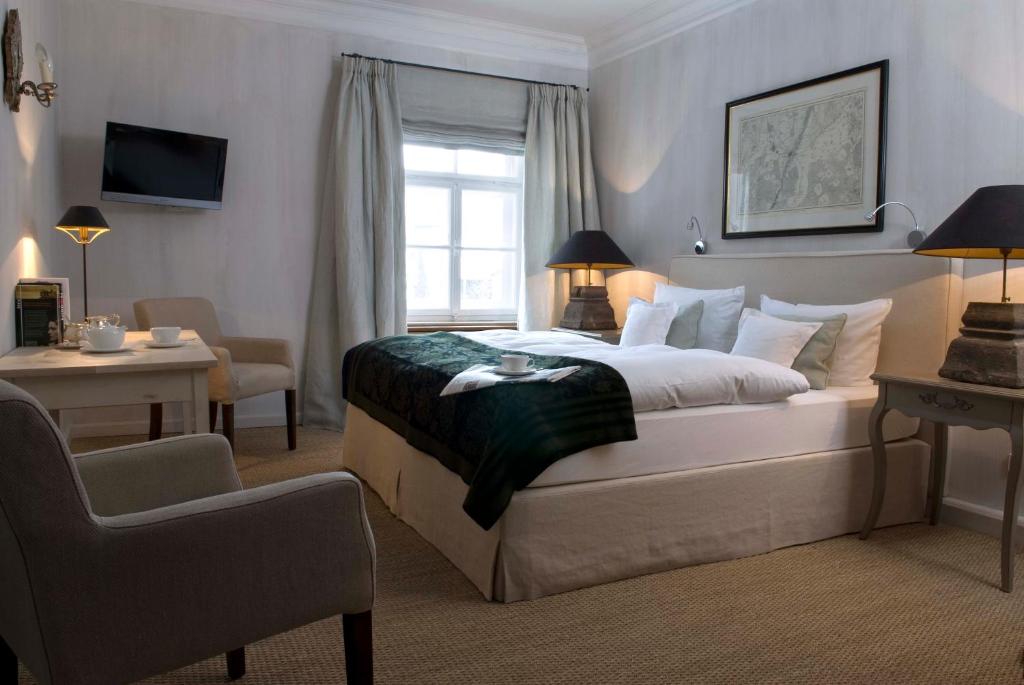 Postel nebo postele na pokoji v ubytování Brauereigasthof-Hotel Aying