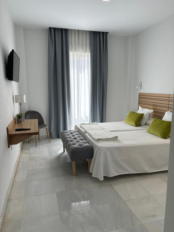 Postel nebo postele na pokoji v ubytování Hotel Lince