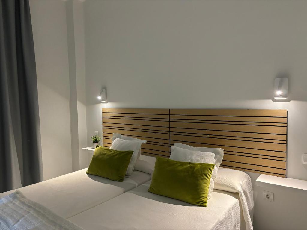 Postel nebo postele na pokoji v ubytování Hotel Lince