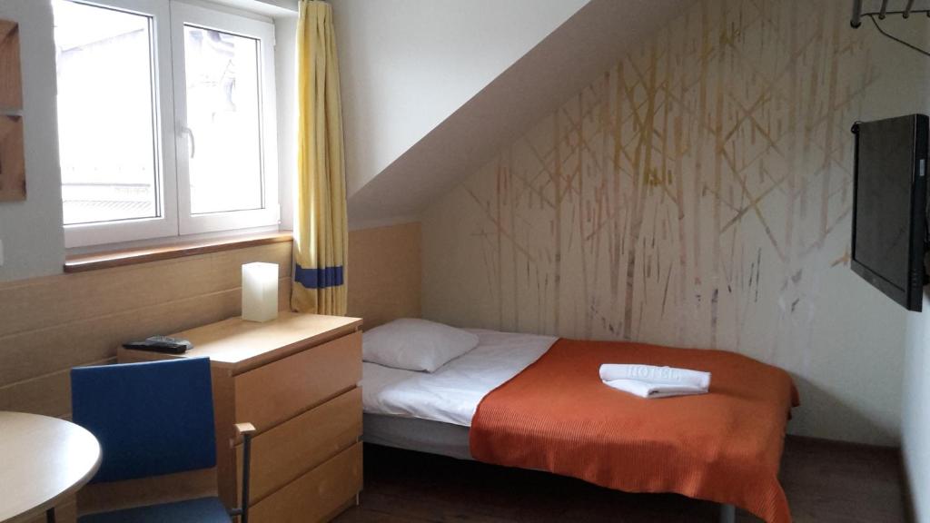 Postel nebo postele na pokoji v ubytování Galeria Pępowo