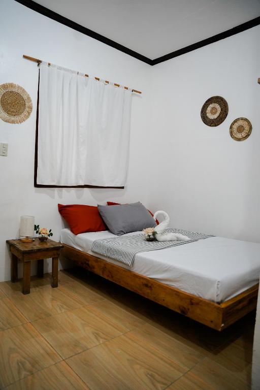 Postel nebo postele na pokoji v ubytování TOBY HOUSE SiARGAO